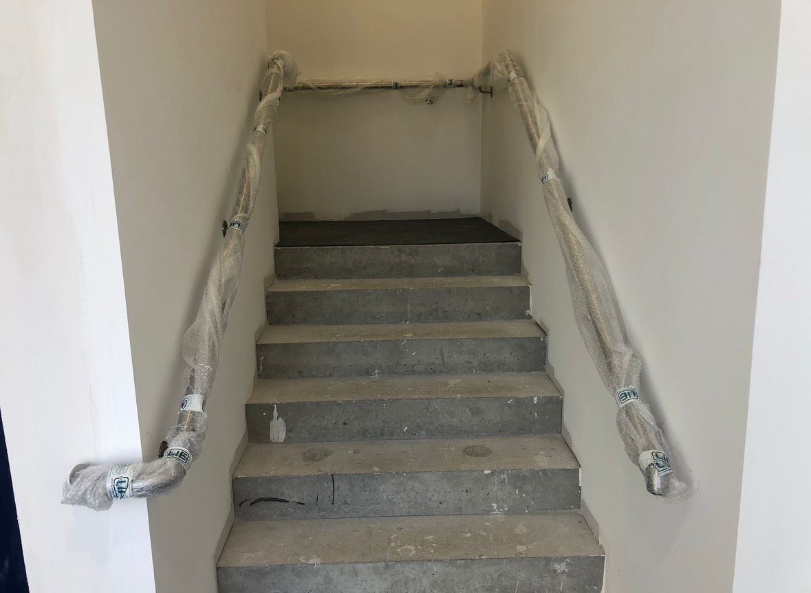 Stainless steel handrails concrete staircase second view