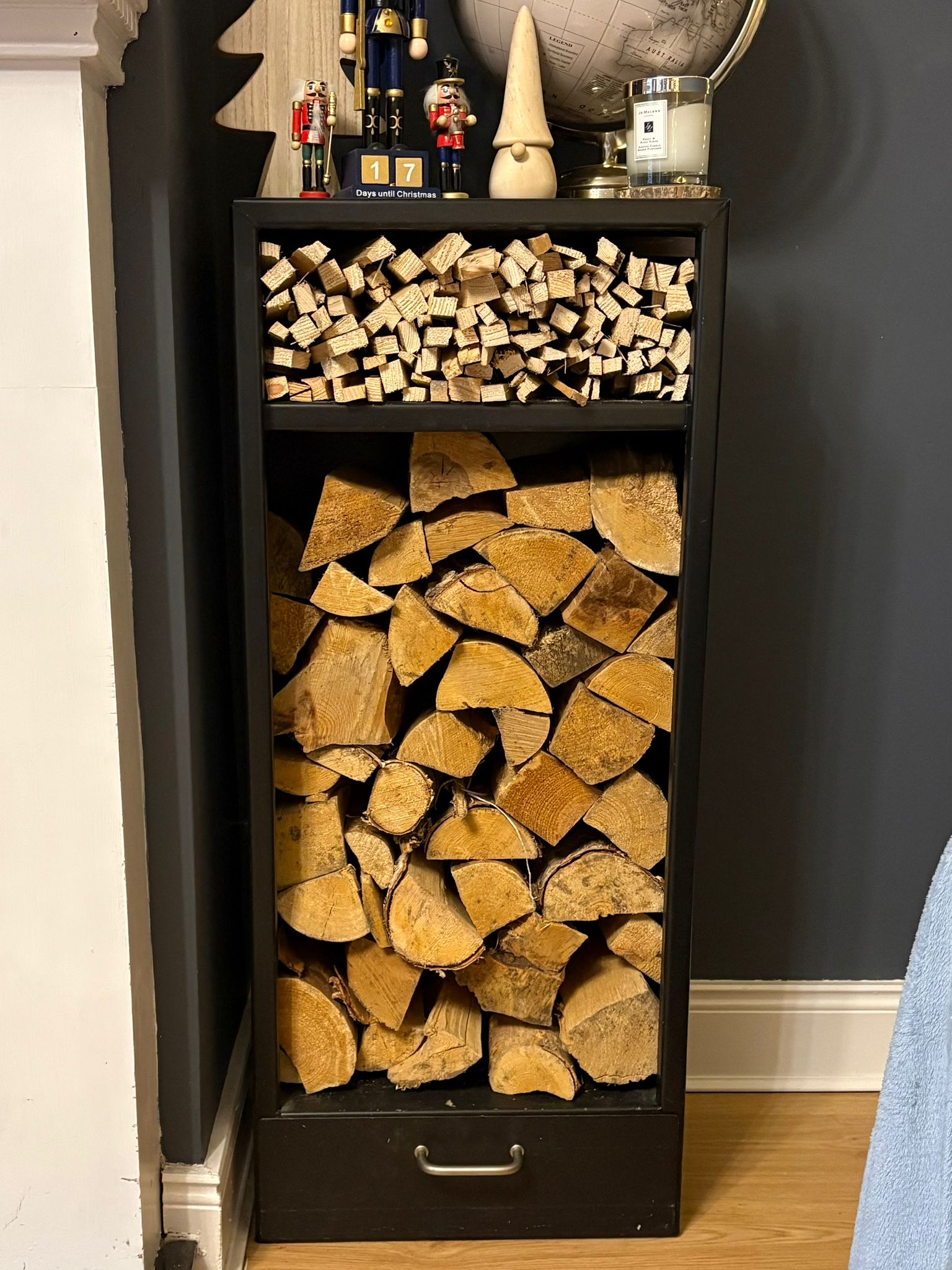 Black powder-coated steel log storage rack