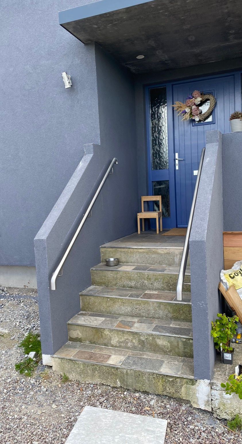Stainless steel handrails on exterior house steps